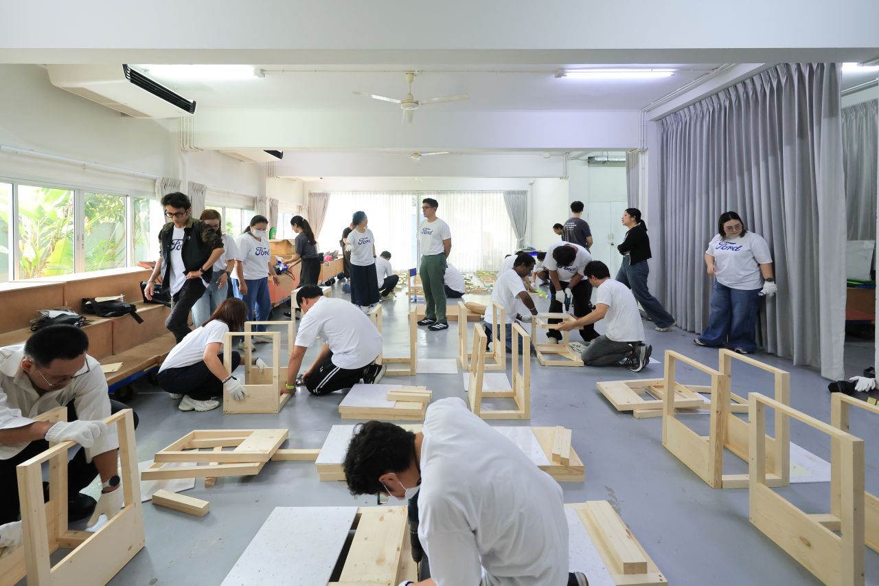 Ford and partner volunteers install desks and other equipment at a school in Rayong, Thailand, as part of Ford's Global Caring Month, September 2026.